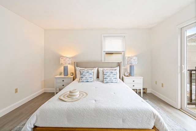 3 Ocean Breeze Unit 2, York, ME 03909 - bedroom featuring light wood finished floors, access to exterior, and baseboards