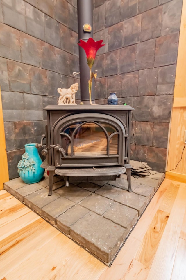 54 Carver Rd, Milo, ME 04463 - detailed view of a wood stove and wood finished floors