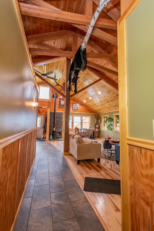 54 Carver Rd, Milo, ME 04463 - hallway featuring wood ceiling, plenty of natural light, wood walls, and a wainscoted wall
