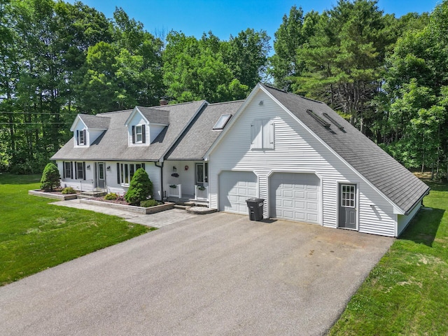 426 Fuller Rd, Carmel, ME 04419 - view of front of property with asphalt driveway, a garage, a shingled roof, a front yard, and a chimney