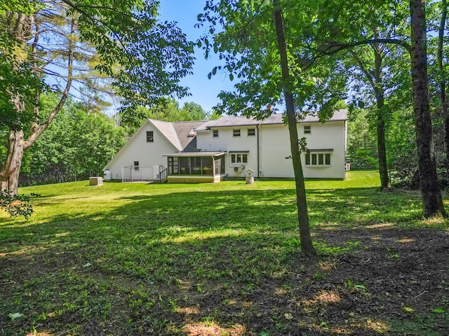 426 Fuller Rd, Carmel, ME 04419 - rear view of property with a sunroom and a lawn