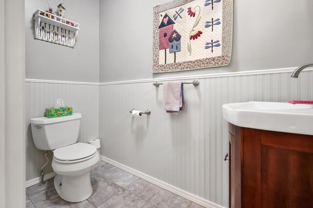 426 Fuller Rd, Carmel, ME 04419 - half bath with vanity and a wainscoted wall