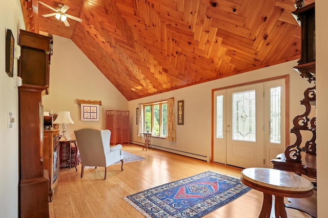 426 Fuller Rd, Carmel, ME 04419 - entryway with vaulted ceiling, a baseboard heating unit, a ceiling fan, wood finished floors, and wooden ceiling