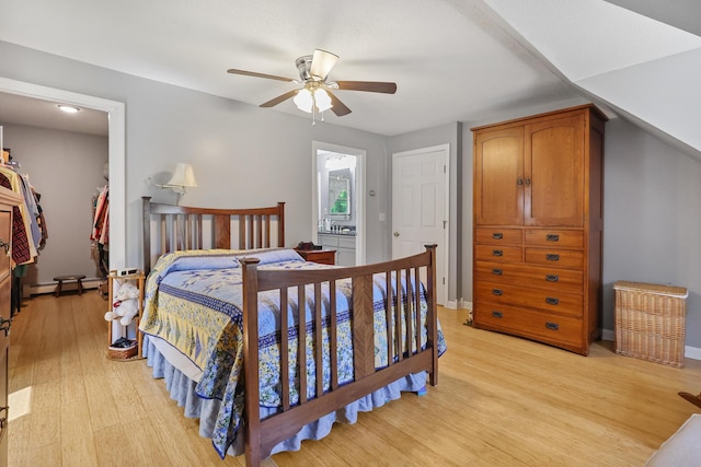 426 Fuller Rd, Carmel, ME 04419 - bedroom with light wood-style flooring, a baseboard radiator, ceiling fan, and ensuite bathroom