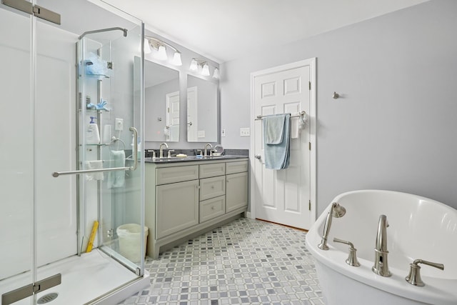 426 Fuller Rd, Carmel, ME 04419 - bathroom with a shower stall, double vanity, a freestanding bath, and tile patterned floors