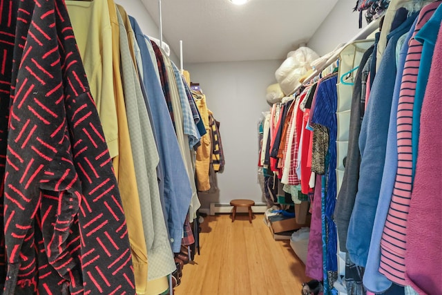 426 Fuller Rd, Carmel, ME 04419 - walk in closet featuring wood finished floors and a baseboard heating unit