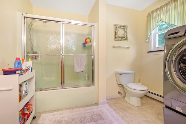 426 Fuller Rd, Carmel, ME 04419 - full bath featuring baseboard heating, washer / dryer, shower / bath combination with glass door, and tile patterned floors