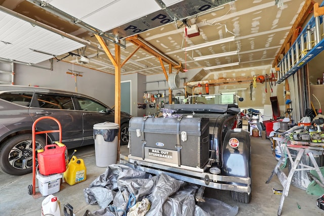 426 Fuller Rd, Carmel, ME 04419 - garage featuring a garage door opener