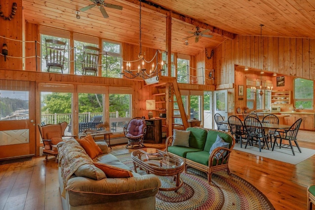 47 Eaton Point Rd, Deer Isle, ME 04627 - living room featuring ceiling fan, wooden walls, a chandelier, high vaulted ceiling, and a wood ceiling with exposed beams
