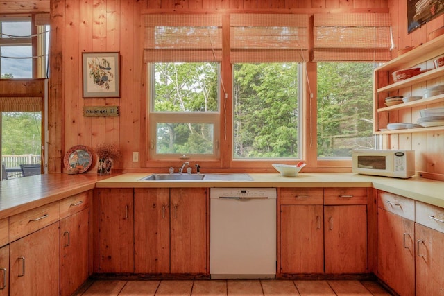 47 Eaton Point Rd, Deer Isle, ME 04627 - kitchen featuring white appliances, light countertops, light tile patterned floors, and wood walls