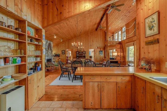 47 Eaton Point Rd, Deer Isle, ME 04627 - kitchen with wood walls, wood ceiling, high vaulted ceiling, a ceiling fan, and light wood finished floors