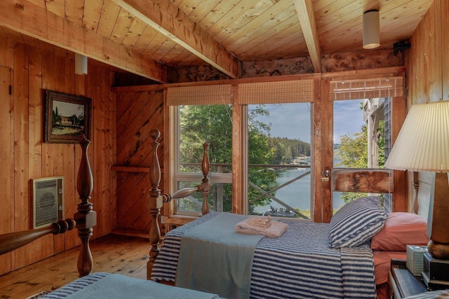 47 Eaton Point Rd, Deer Isle, ME 04627 - bedroom featuring a wood ceiling with exposed beams, wood walls, hardwood / wood-style floors, multiple windows, and a water view