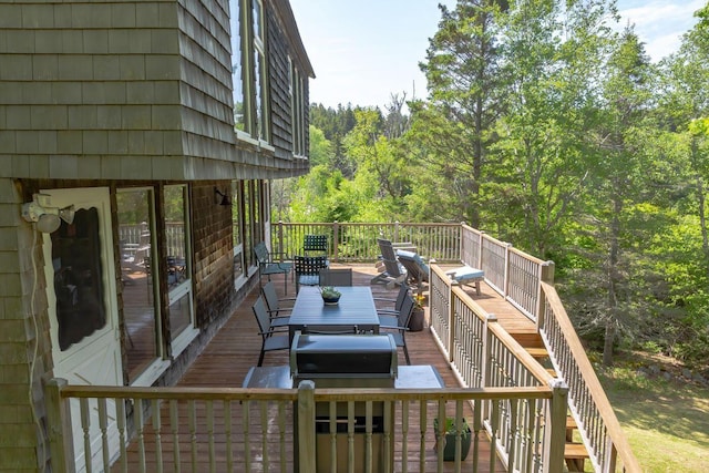 47 Eaton Point Rd, Deer Isle, ME 04627 - wooden terrace featuring outdoor dining space, a forest view, and a grill
