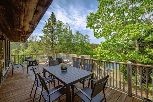 47 Eaton Point Rd, Deer Isle, ME 04627 - deck featuring outdoor dining area and a view of trees