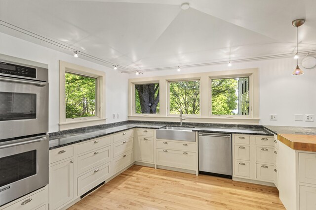 565 Bagaduce Rd, Brooksville, ME 04617 - kitchen with stainless steel appliances, a sink, wooden counters, light wood finished floors, and hanging light fixtures
