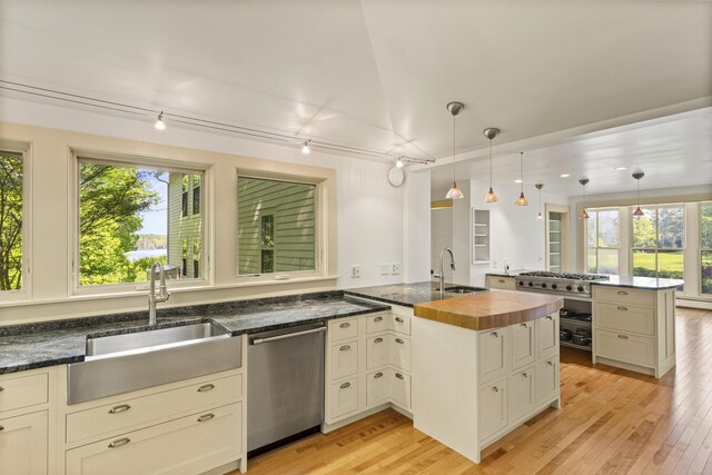 565 Bagaduce Rd, Brooksville, ME 04617 - kitchen with stainless steel appliances, a sink, a peninsula, and plenty of natural light