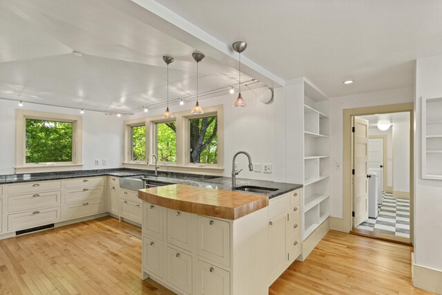 565 Bagaduce Rd, Brooksville, ME 04617 - kitchen featuring a sink, wood counters, light wood-style flooring, and recessed lighting