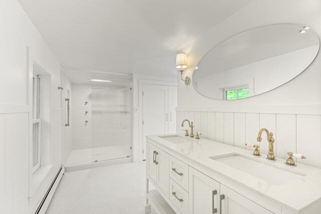 565 Bagaduce Rd, Brooksville, ME 04617 - full bath with a baseboard heating unit, double vanity, a stall shower, and a wainscoted wall