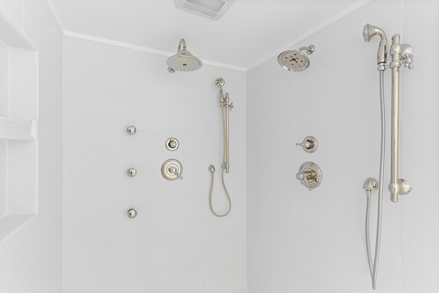 565 Bagaduce Rd, Brooksville, ME 04617 - bathroom view of a tile shower and crown molding