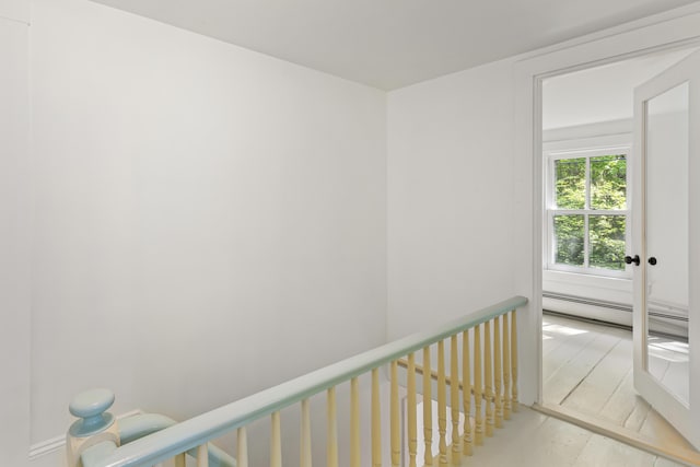 565 Bagaduce Rd, Brooksville, ME 04617 - corridor featuring baseboard heating and wood finished floors