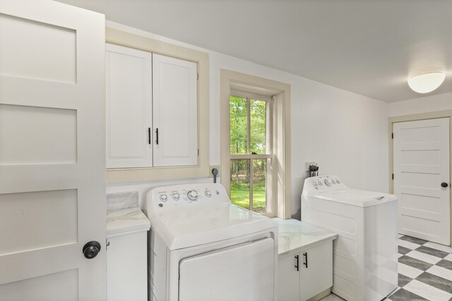 565 Bagaduce Rd, Brooksville, ME 04617 - laundry area featuring cabinet space, washing machine and dryer, and light floors