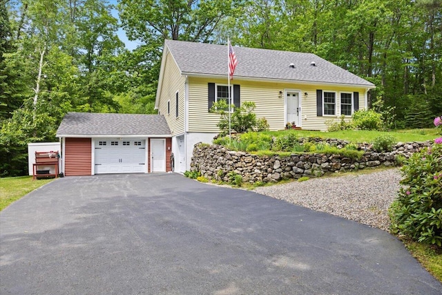 489 Shady Nook Rd, Newfield, ME 04095 - view of front facade featuring driveway, a garage, and a shingled roof