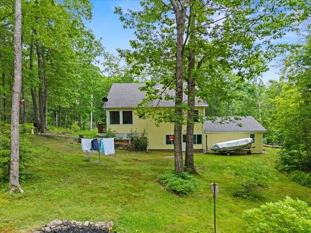 489 Shady Nook Rd, Newfield, ME 04095 - back of property featuring a yard and roof with shingles