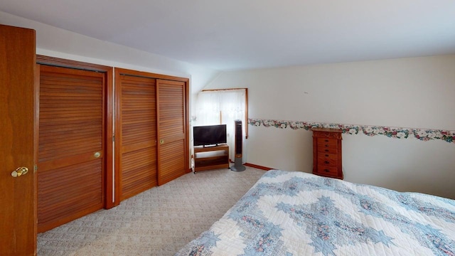 180 Bowdoin St, Millinocket, ME 04462 - bedroom with two closets, carpet flooring, and vaulted ceiling