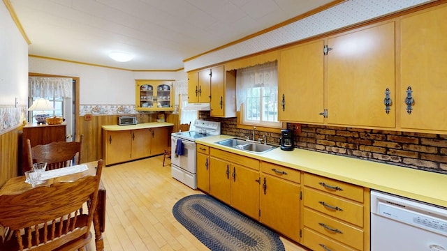 180 Bowdoin St, Millinocket, ME 04462 - kitchen with white appliances, a sink, crown molding, a wainscoted wall, and under cabinet range hood