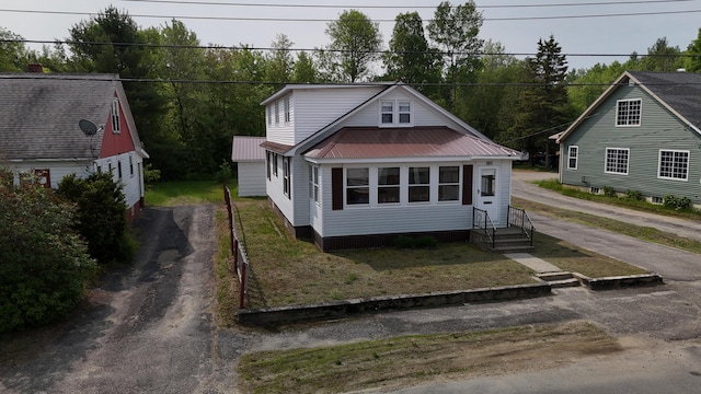 180 Bowdoin St, Millinocket, ME 04462 - bungalow-style house with driveway and metal roof