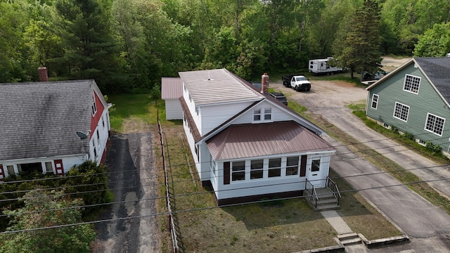 180 Bowdoin St, Millinocket, ME 04462 - aerial view of property and surrounding area with a heavily wooded area