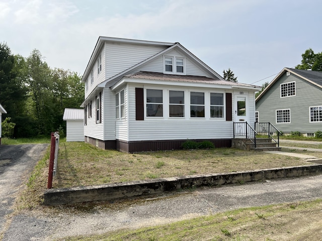 180 Bowdoin St, Millinocket, ME 04462 - view of front facade with metal roof