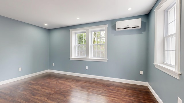 422 Centre St, Bath, ME 04530 - spare room featuring a wall mounted air conditioner, dark wood-style flooring, and recessed lighting