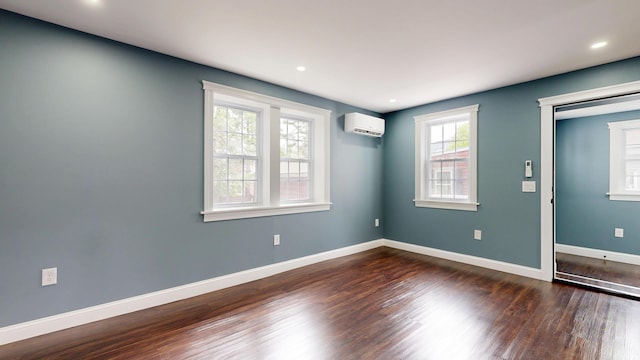 422 Centre St, Bath, ME 04530 - unfurnished room featuring a wall mounted AC, dark wood-style flooring, and recessed lighting