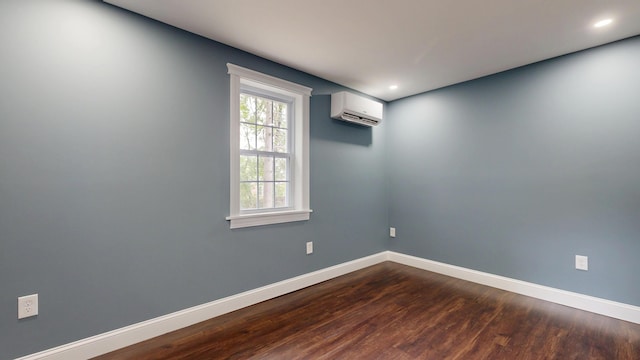 422 Centre St, Bath, ME 04530 - empty room with an AC wall unit, dark wood-style flooring, and recessed lighting
