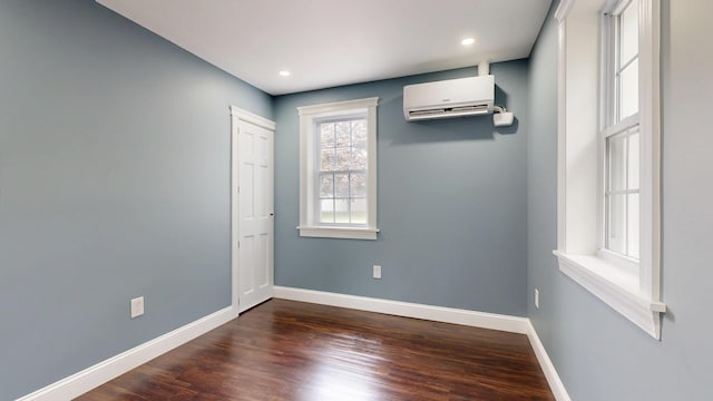 422 Centre St, Bath, ME 04530 - unfurnished room featuring a wall unit AC, dark wood finished floors, and recessed lighting