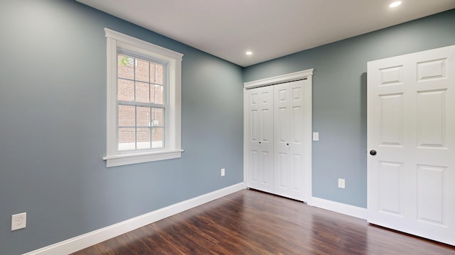 422 Centre St, Bath, ME 04530 - unfurnished bedroom featuring multiple windows, dark wood finished floors, recessed lighting, and a closet