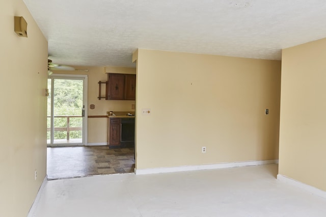 1372 Post Rd Unit 3A, Wells, ME 04090 - empty room with a textured ceiling, a ceiling fan, and baseboards