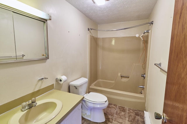 1372 Post Rd Unit 3A, Wells, ME 04090 - full bath with a textured ceiling, vanity, shower / tub combination, toilet, and stone finish flooring