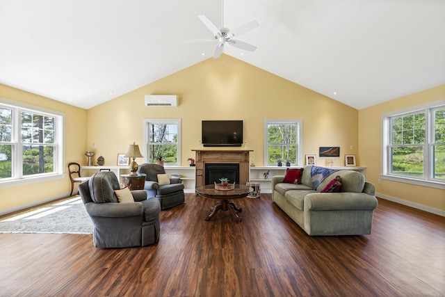 189 Basin Point Rd, Harpswell, ME 04079 - living area featuring an AC wall unit, wood finished floors, high vaulted ceiling, a fireplace, and a ceiling fan