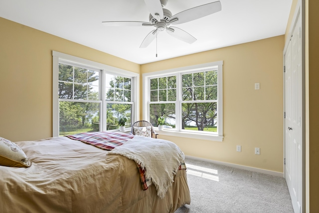 189 Basin Point Rd, Harpswell, ME 04079 - carpeted bedroom with baseboards and ceiling fan