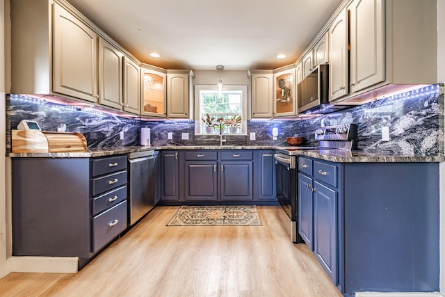 29 Harding St, Biddeford, ME 04005 - kitchen with stainless steel appliances, light wood-style flooring, tasteful backsplash, and recessed lighting
