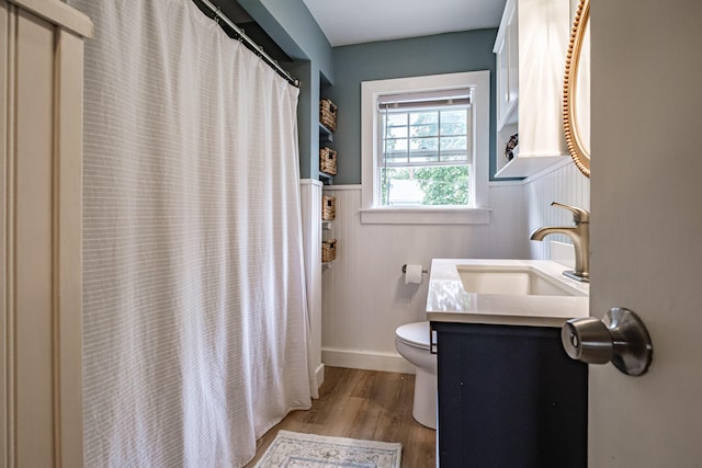 29 Harding St, Biddeford, ME 04005 - full bathroom with toilet, wainscoting, wood finished floors, vanity, and curtained shower