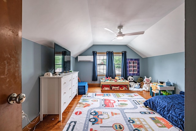 29 Harding St, Biddeford, ME 04005 - bedroom featuring a wall mounted AC, wood finished floors, lofted ceiling, and a ceiling fan