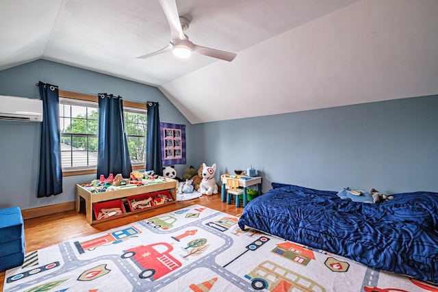 29 Harding St, Biddeford, ME 04005 - bedroom with lofted ceiling, an AC wall unit, wood finished floors, and ceiling fan
