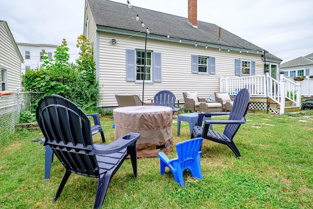 29 Harding St, Biddeford, ME 04005 - rear view of property featuring an outdoor fire pit, a chimney, and roof with shingles