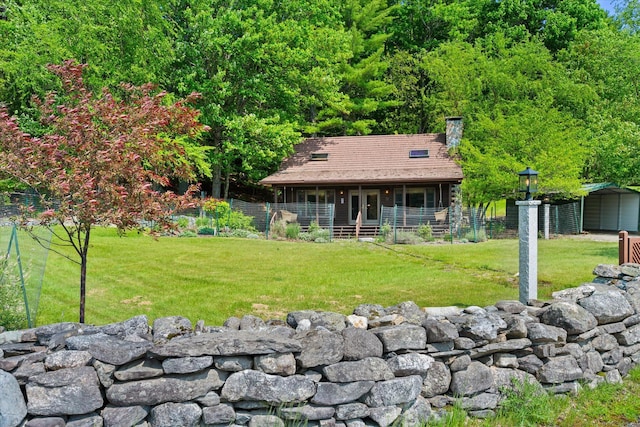 41 Canal St, Grand Lake Stream Plt, ME 04668 - rear view of property with a chimney