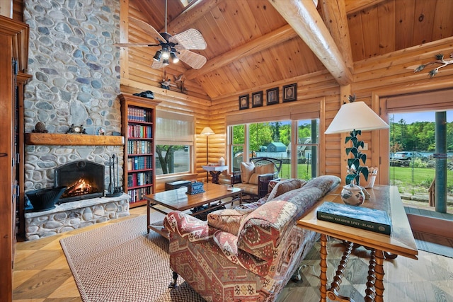 41 Canal St, Grand Lake Stream Plt, ME 04668 - living room featuring wood ceiling with exposed beams, rustic walls, plenty of natural light, a fireplace, and a ceiling fan