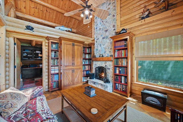 41 Canal St, Grand Lake Stream Plt, ME 04668 - living area featuring log walls, ceiling fan, a fireplace, wood finished floors, and wooden ceiling
