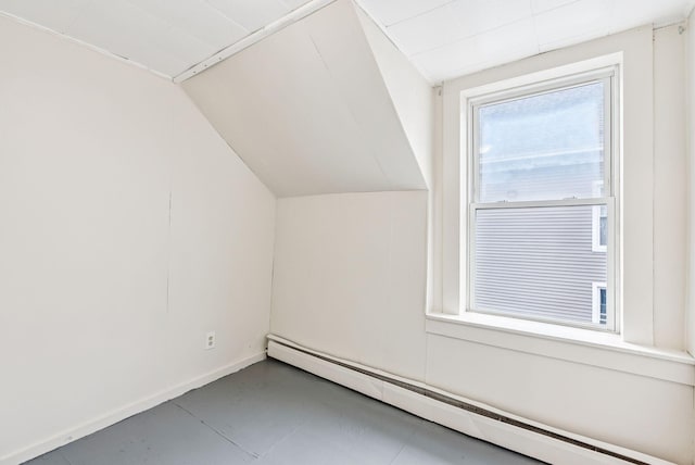 13-15 James St, Auburn, ME 04210 - additional living space featuring a baseboard radiator and vaulted ceiling